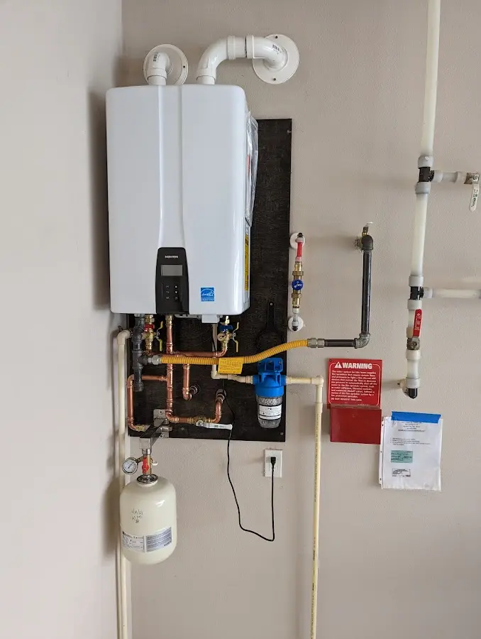Professional plumber installing copper piping in a Owings Mills home